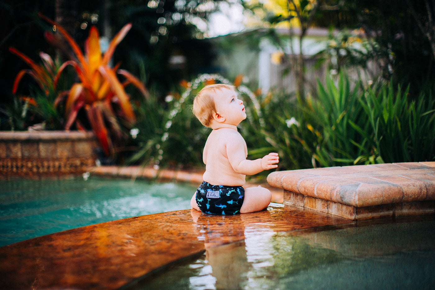 Lighthouse Kids Co. Reusable Swim Cloth Diaper with Athletic Wicking Jersey.  Recycled and PFAS free.  Safe for swimming and for the beach baby.  Washable and reusable swim diaper.