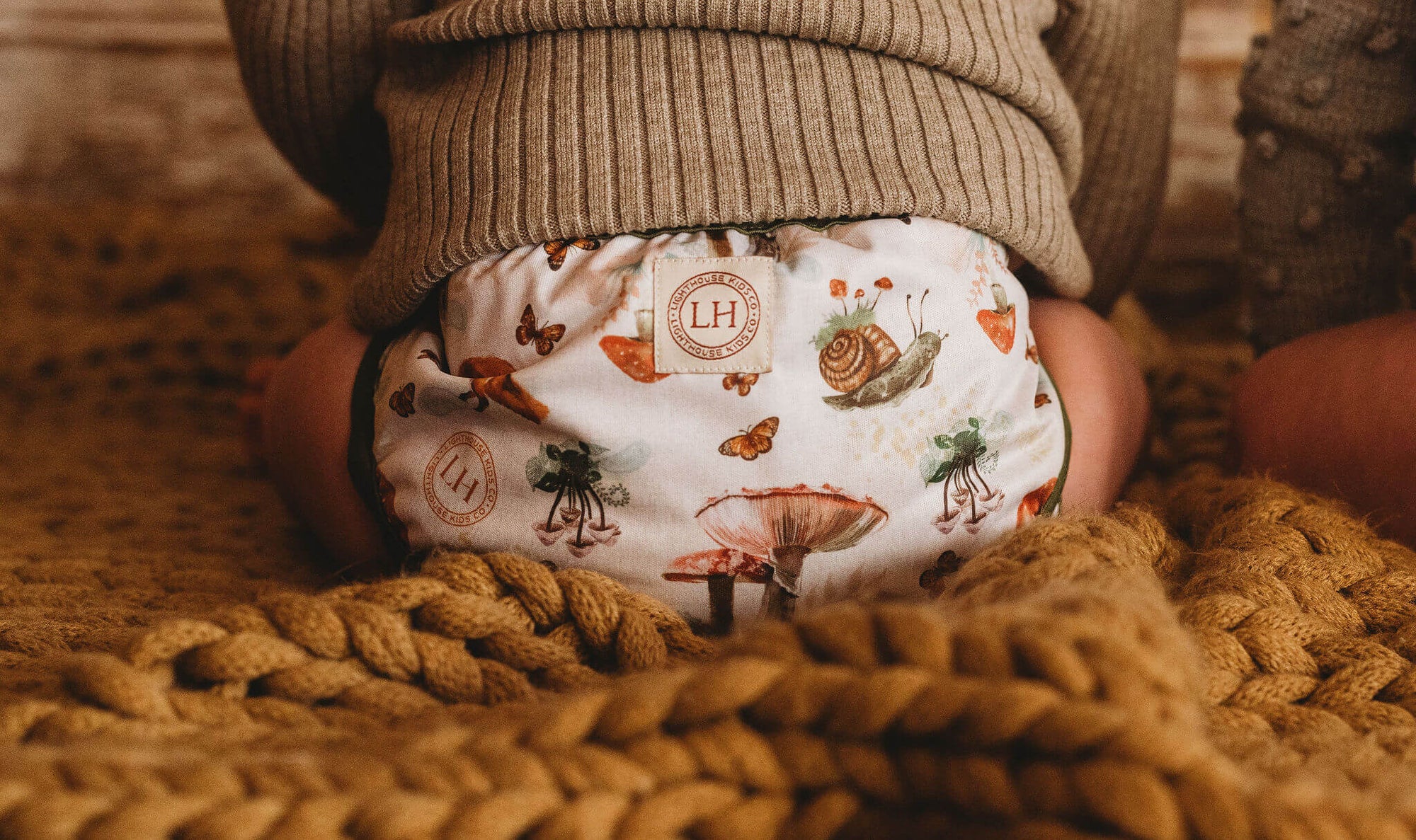 Lighthouse Kids Co. recycled all-in-one cloth diapers with Athletic Wicking Jersey AWJ and Tummy Panel.  Small WAHM business in Iowa City, IA.