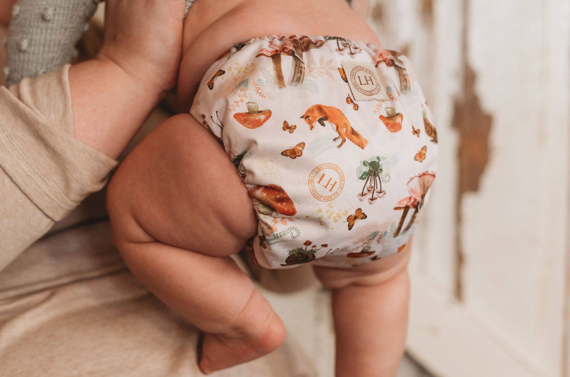 Lighthouse Kids Co. recycled all-in-one cloth diapers with Athletic Wicking Jersey AWJ and Tummy Panel.  Small WAHM business in Iowa City, IA.