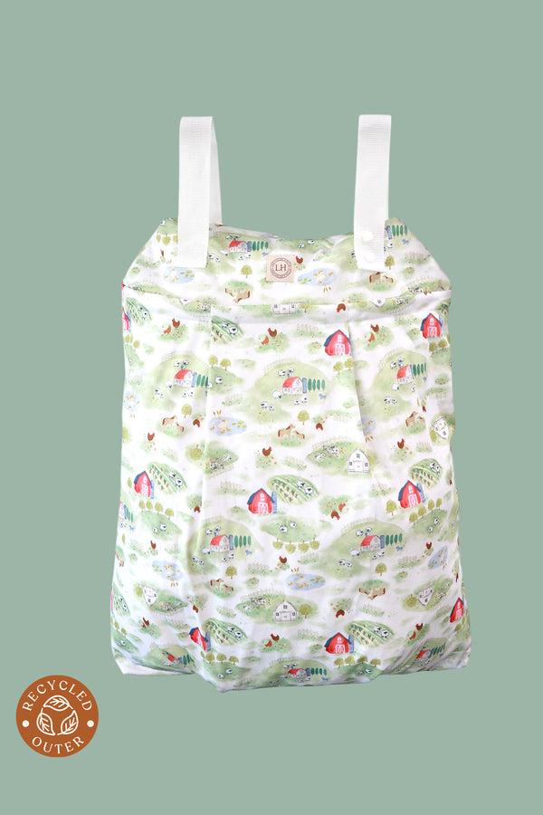 The Lighthouse Kids Company Hanging Diaper Pail is a great solution for storing cloth diapers between washes. 
 Made with 2 heavy-duty layers of recycled TPU, this pail liner keeps smells in and holds approximately 30 cloth diapers. Great for traveling and long outings.  Print Farm